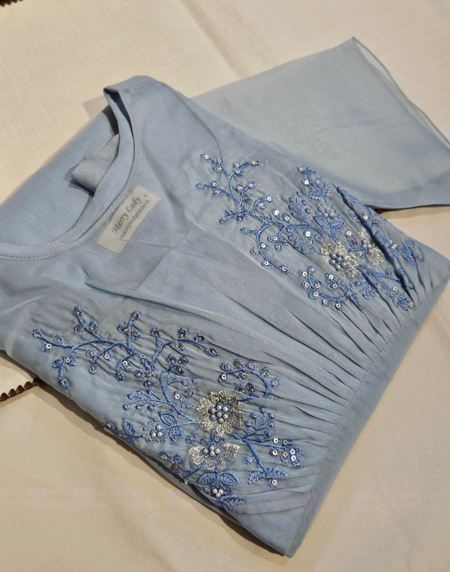 Blue soft organza kurti/dress with pleated yoke detailed with thread embroidery and sequins MBS-704