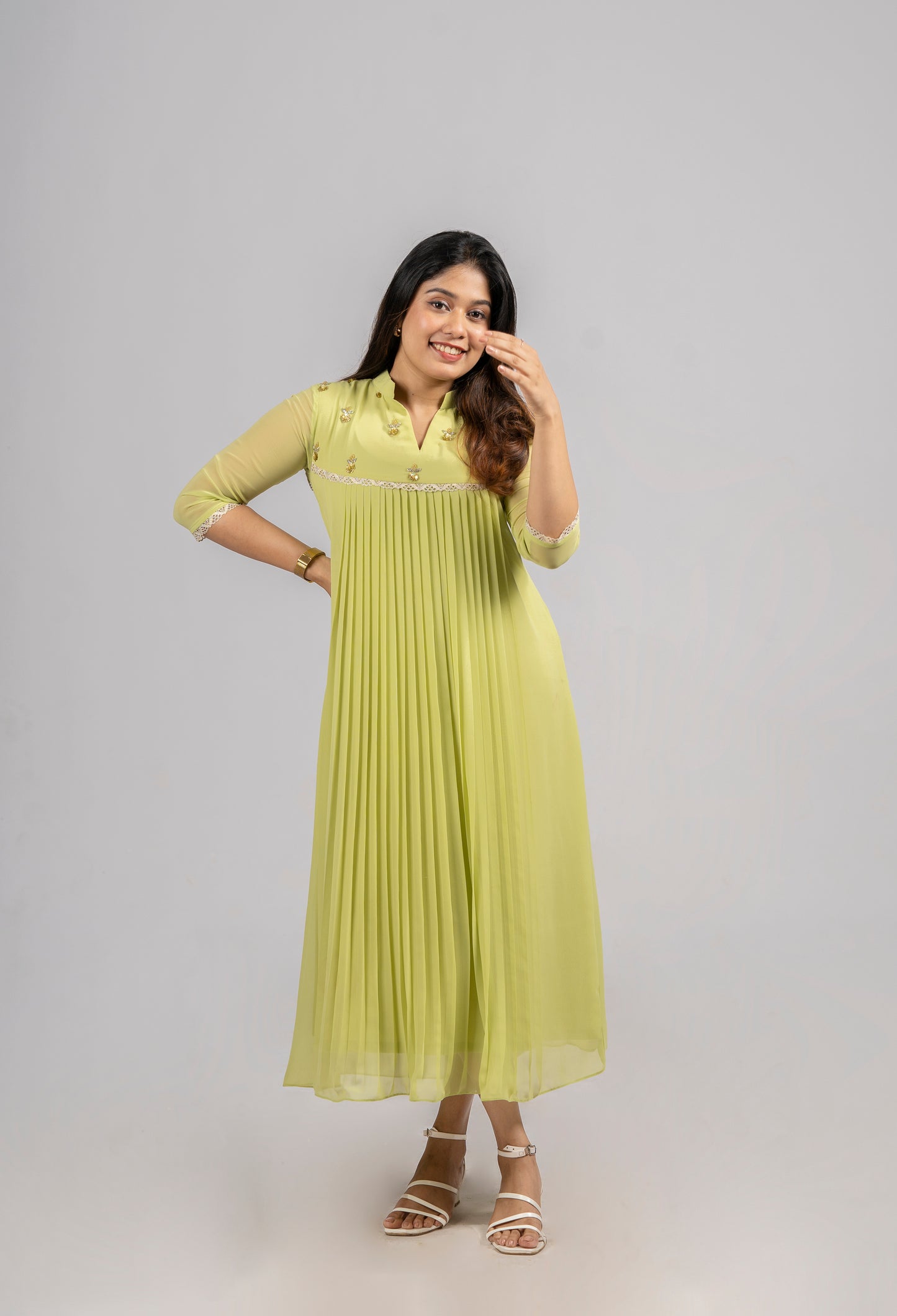 Greenish yellow shaded georgette A-line kurti with handworked yoke and lace detailing MBS-255