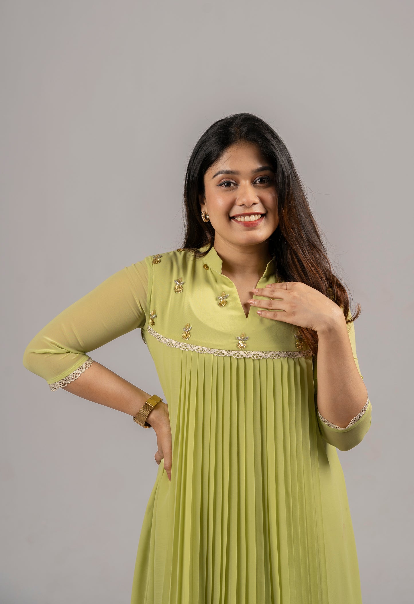 Greenish yellow shaded georgette A-line kurti with handworked yoke and lace detailing MBS-255