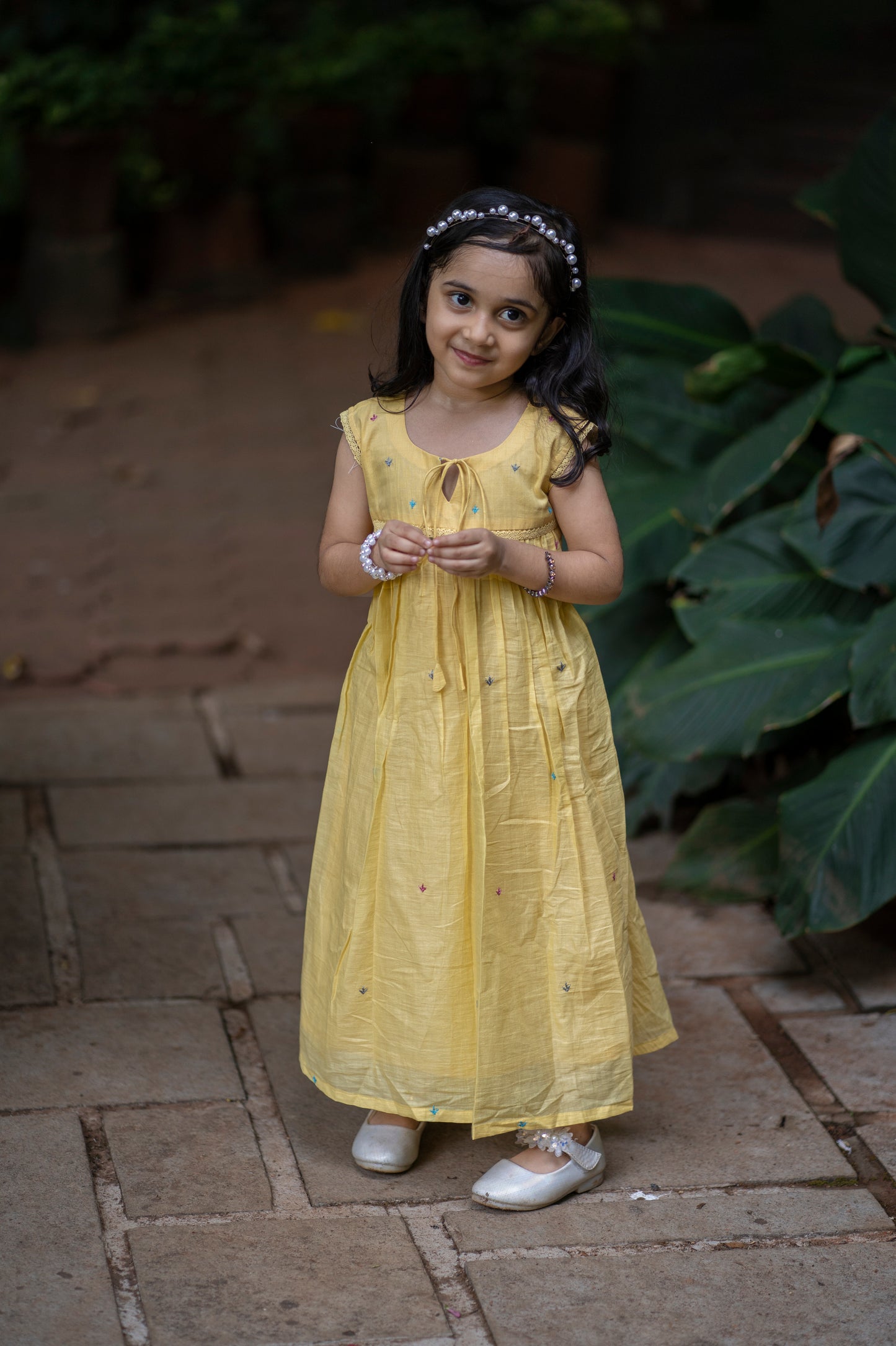 Yellow soft mul cotton kids frock with floral embroidery detailings MBS-350