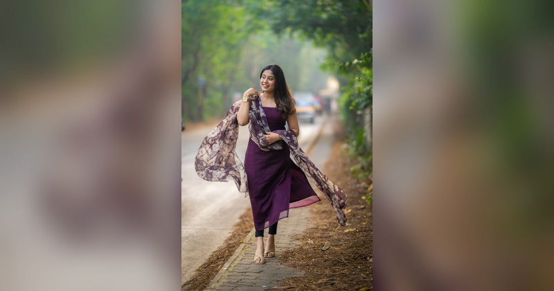 Woman in a purple kurti with a contrasting printed dupatta, a dupatta color combination with kurti idea