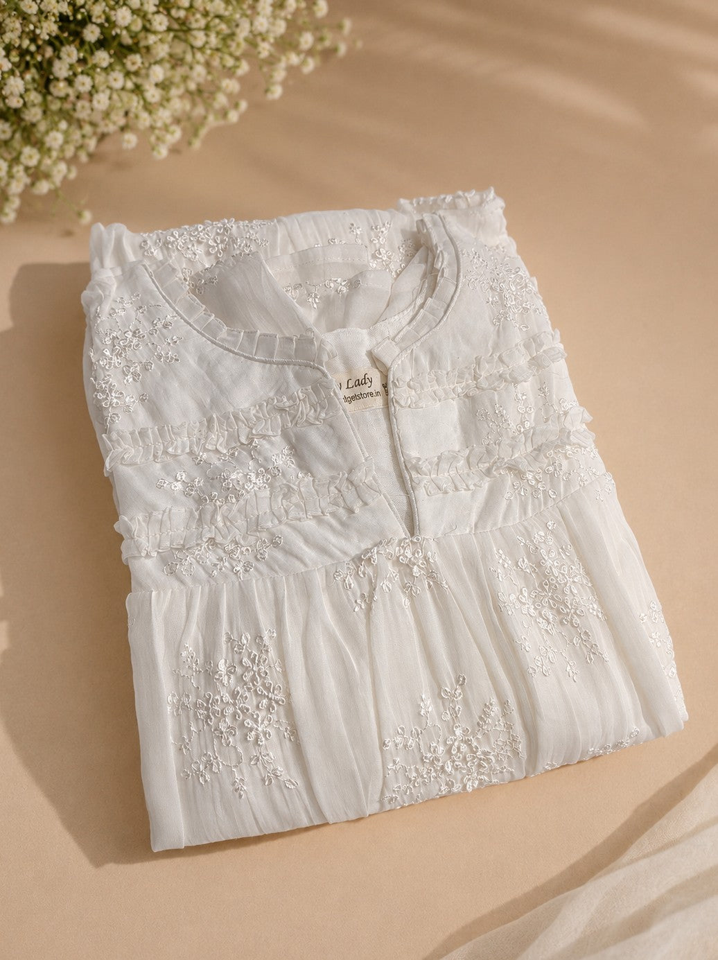 Pearl white mulchanderi Aline kurti/dress with all over floral thread embroidery detailings MBS-1289