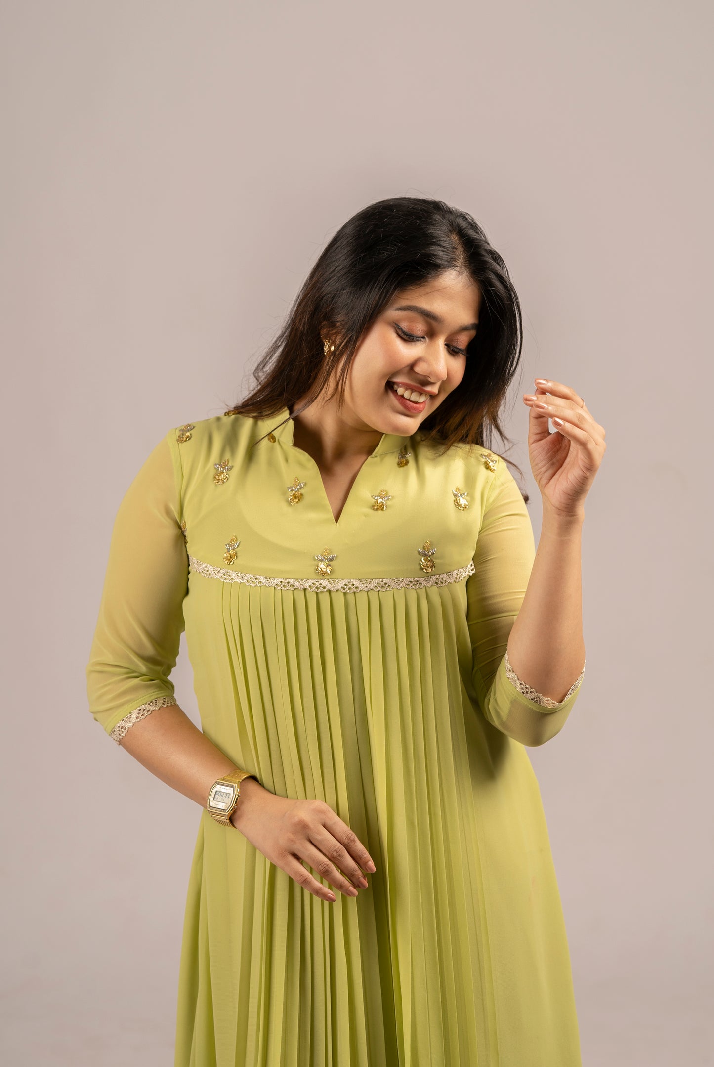 Greenish yellow shaded georgette A-line kurti with handworked yoke and lace detailing MBS-255