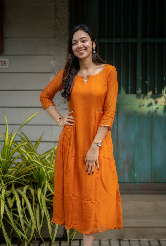 Orange shaded viscose organza A-line kurti with handwork detailings with santoon lining MBS-584
