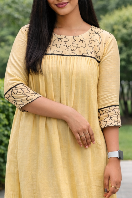 Soft beige shaded viscose mul chanderi A-line kurti with black floral thread embroidered yoke MBS-841 **Onam 26**